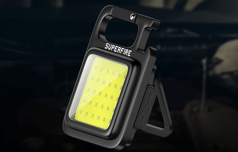 Portable Superfire lamp with handle and foldable stand, equipped with a light panel