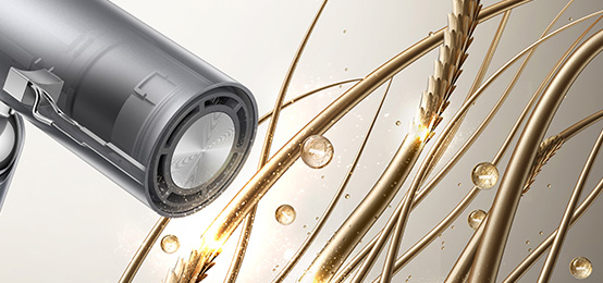 Lähivõte moodsast föönist, mis on suunatud ioniseeriva ja niisutava efektiga juuksekiududele