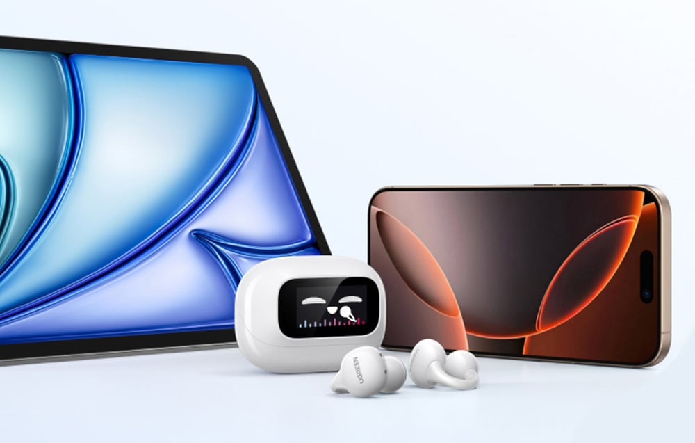 The case with the wireless headphones lies next to the tablet and smartphone