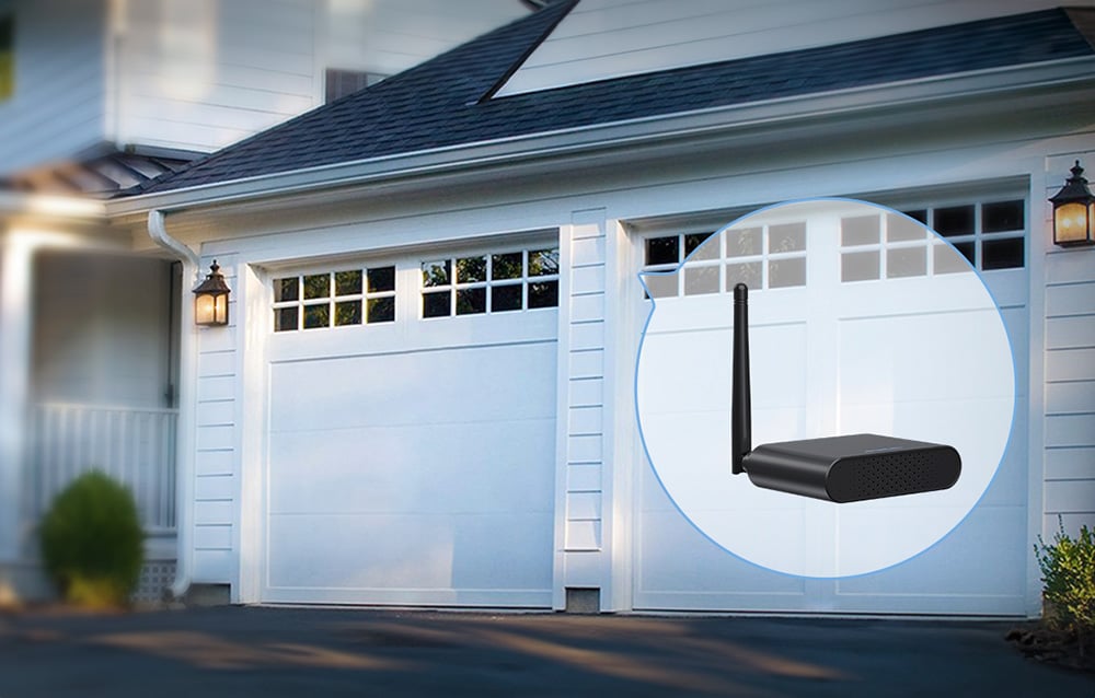 White house with two garages, the graphic shows a close-up of a black controller with an antenna