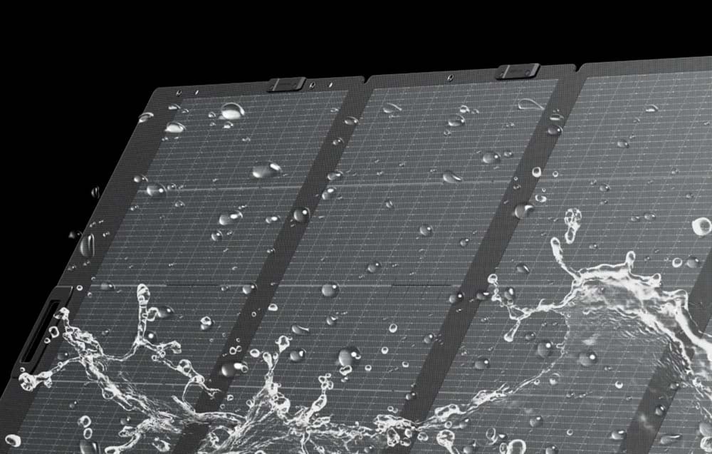 Photovoltaic panel splashed with water on a black background