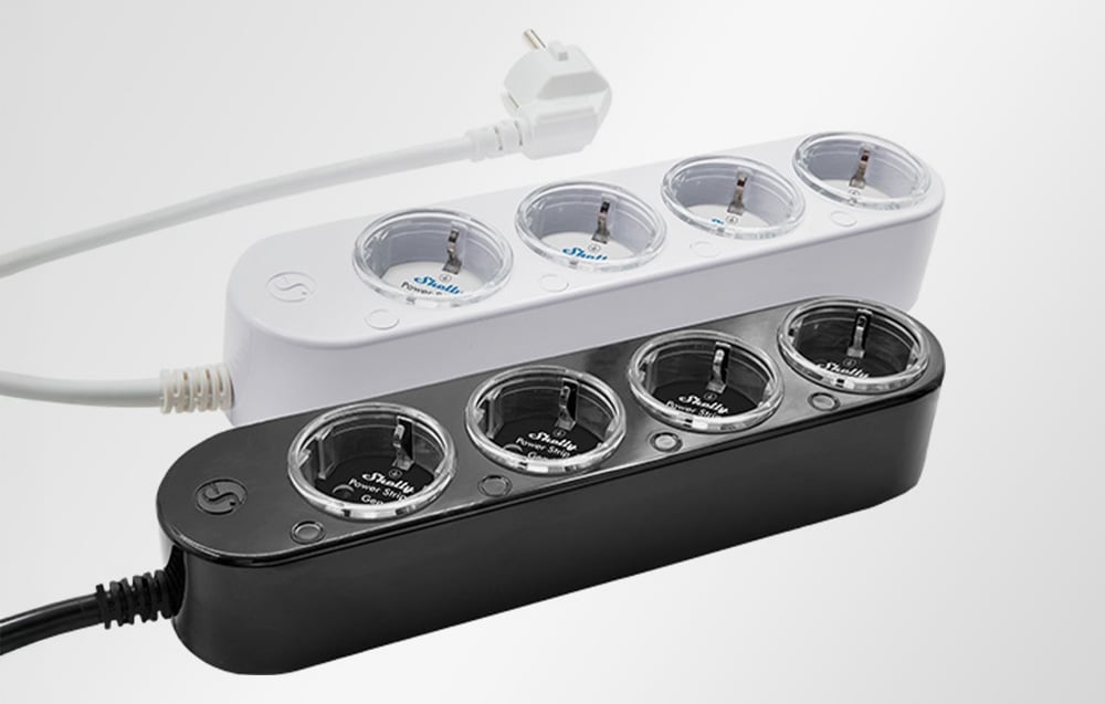 Two Shelly Power Strip 4 power strips - one white, the other black - with four outlets and round buttons