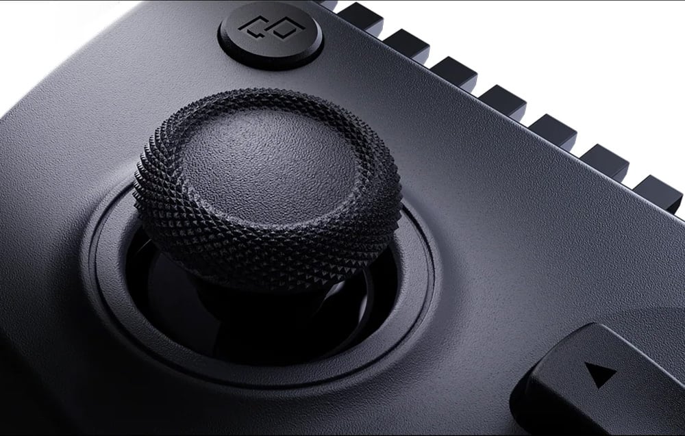 close-up of the left analog stick of the controller with textured surface