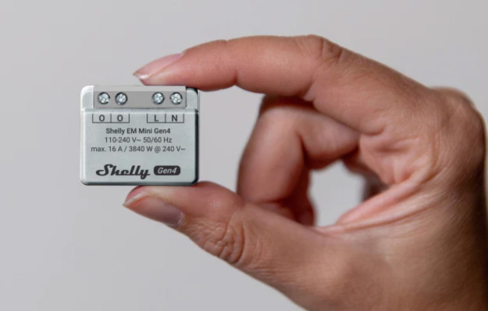 Shelly's small energy meter held in her hand