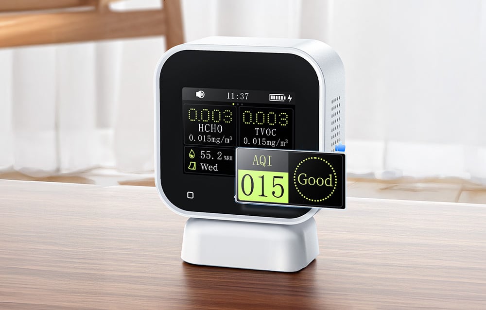 Air quality monitor with a magnified view of the AQI index showing a good air quality rating.