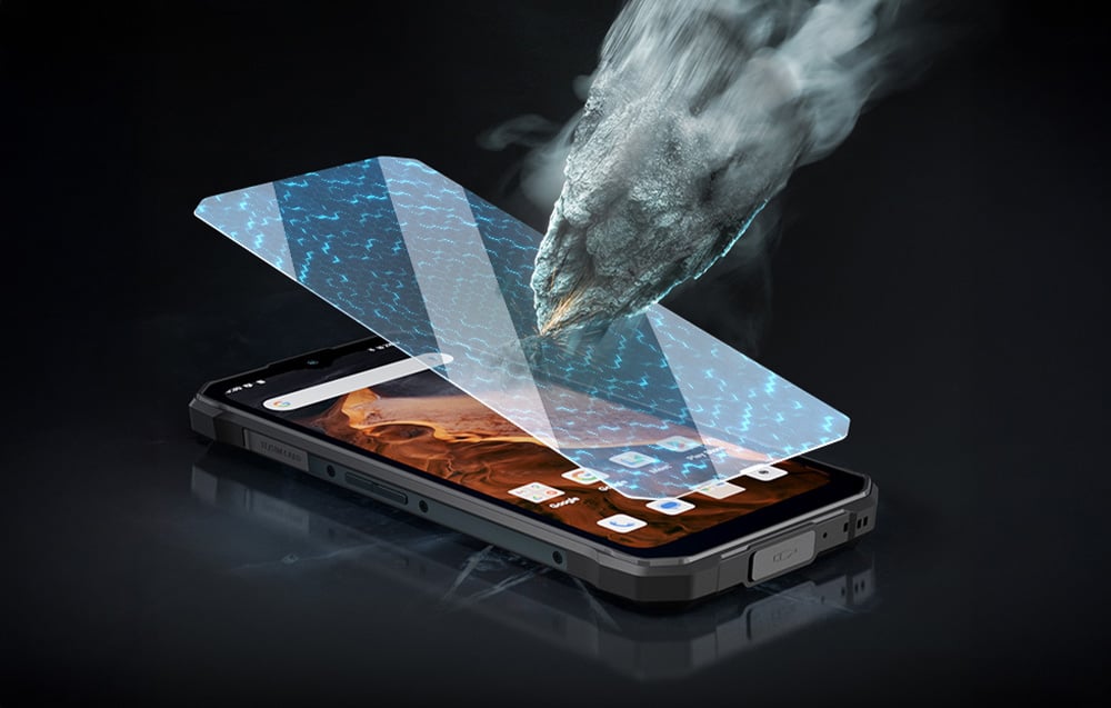 Telefon i szkło hartowane, na które upada kamień