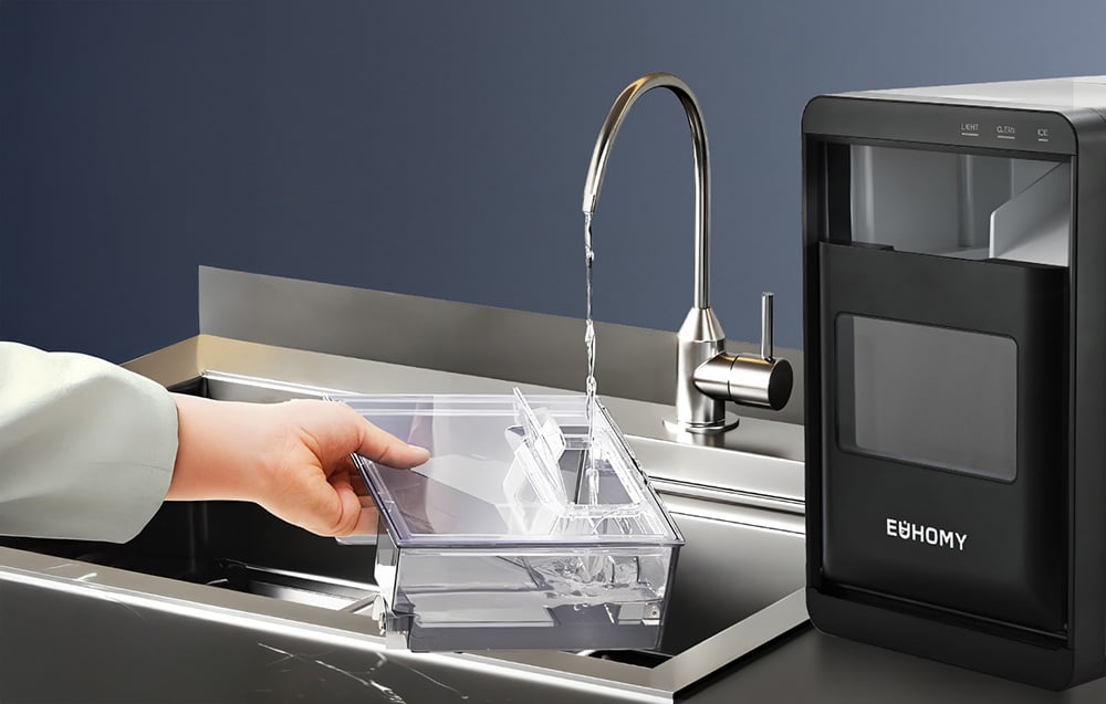 Water tank being filled, next to the ice cube maker