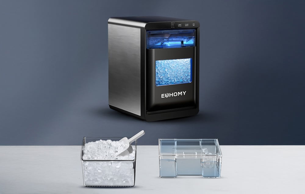 Black Euhomy ice cube maker, next to a basket with a scoop and ice and a water tank