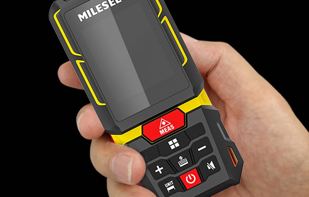 Laser rangefinder held in the hand, showcasing the control buttons and the device’s ergonomic design.