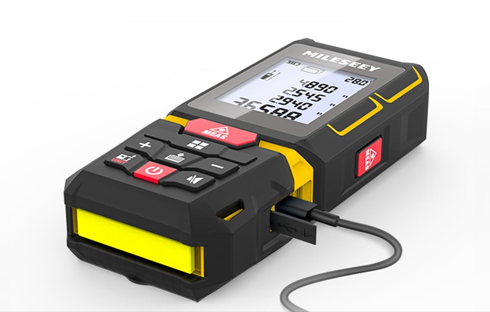 Laser rangefinder connected to a charging cable.